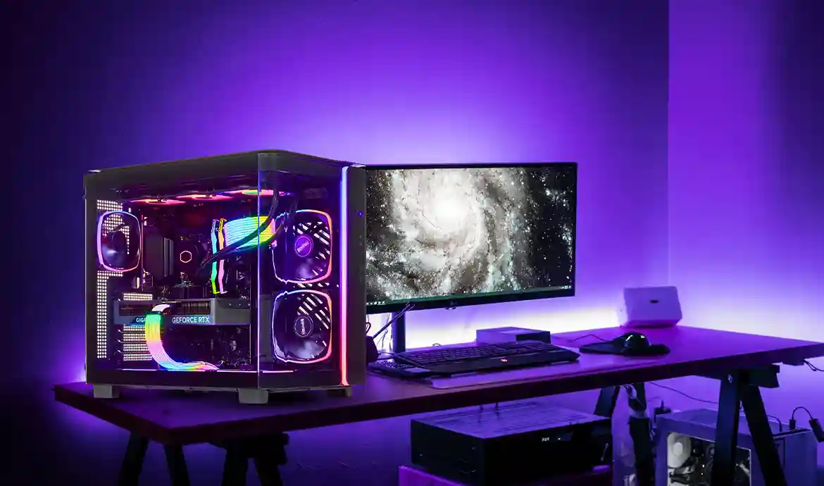 Setup aksesoris gaming lengkap dengan keyboard, mouse, headset, dan monitor RGB modern
